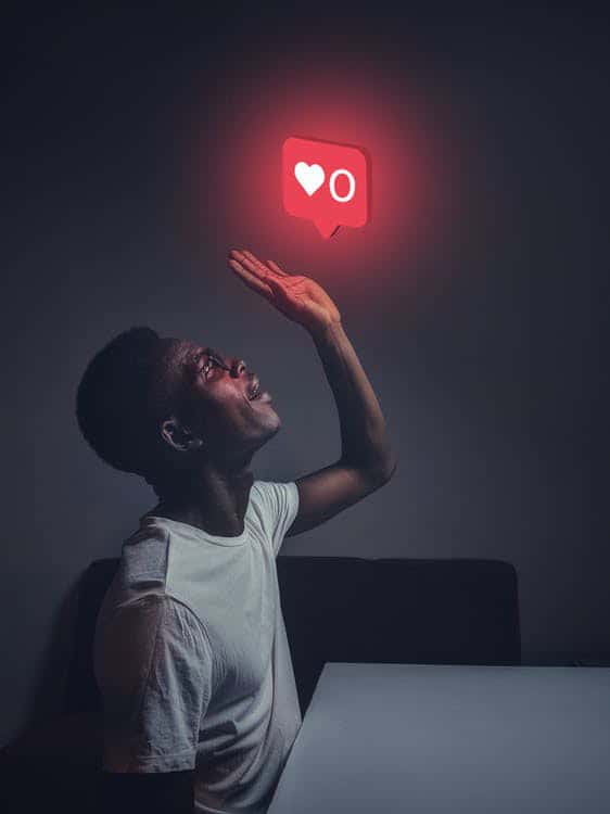 Black man looking up at a glowing IG icon | Social Media Trends for Business