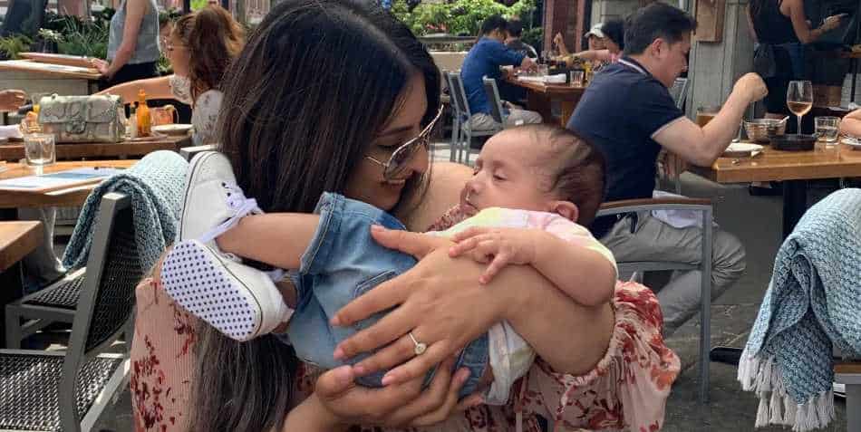 Aiyna Dhillon | Parenting influencer with her baby Milan in cafe