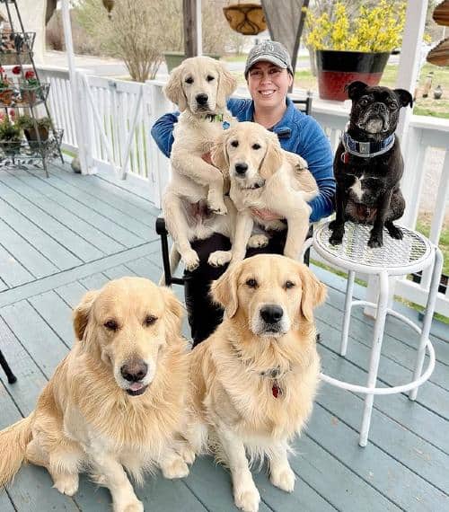 Dog influencer Alissa sitting outside with her pets