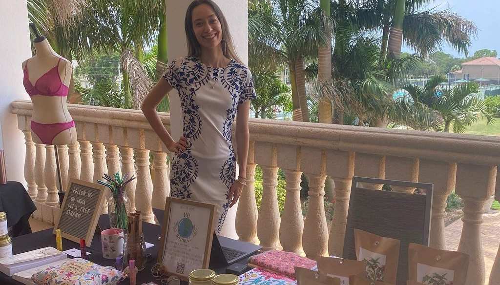 Ashley Mulholland managing her Elli Wellness organic stall