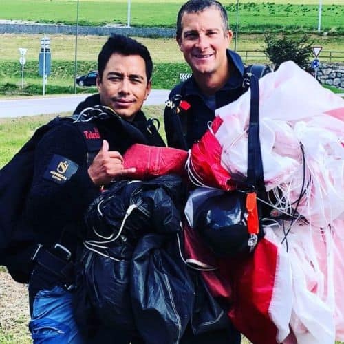 Adventure Reality Star Bear Grylls with parachute after skydiving