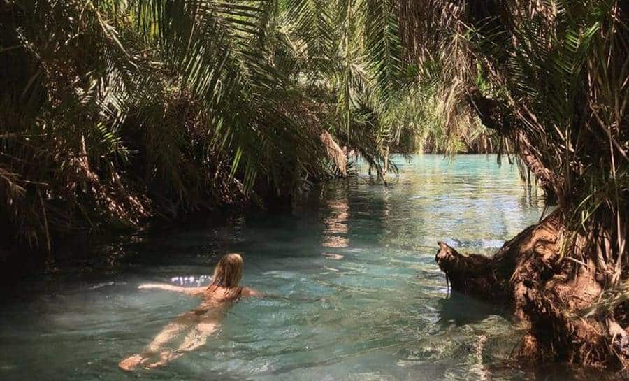 Cecilie Philip swimming in the rainforest river | Tropical travels