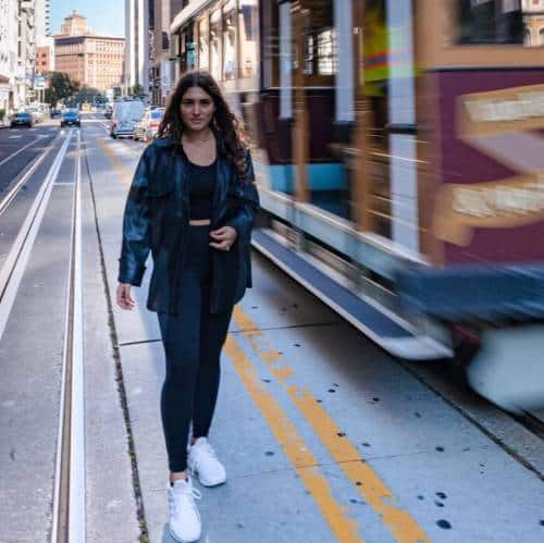 Chloe Jade Meltzer walking past a tram | Photography session in the city