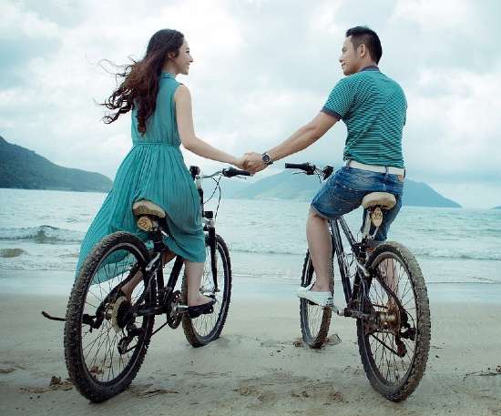 Traveling Couples | Bike Rides while holding hands on the Beach