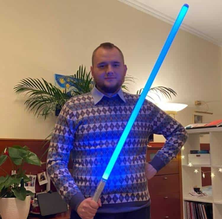 Denis Stelmak wielding a blue lightsaber