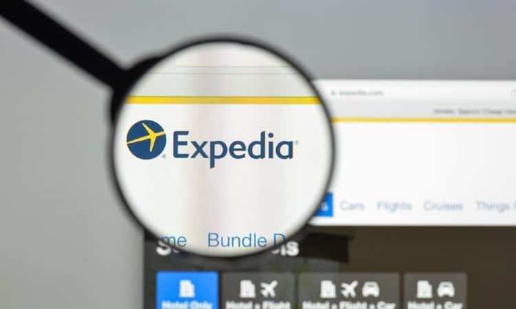 magnifying glass over Expedia brand logo