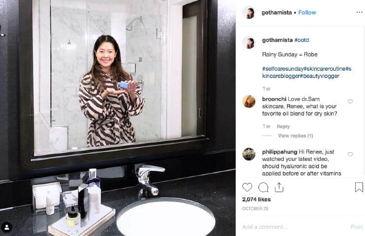 Renée aka gothamista wearing robe in bathroom