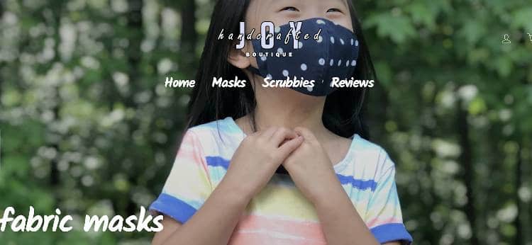 Handcrafted Joy Boutique | Kid wearing fabric mask