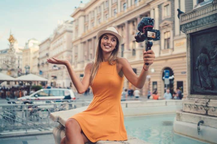 Influencer taking selfie in top travel location