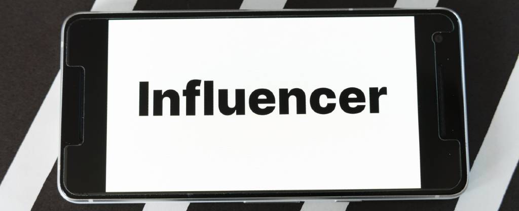 Mobile with influencer on screen | Influencer Marketing Trends