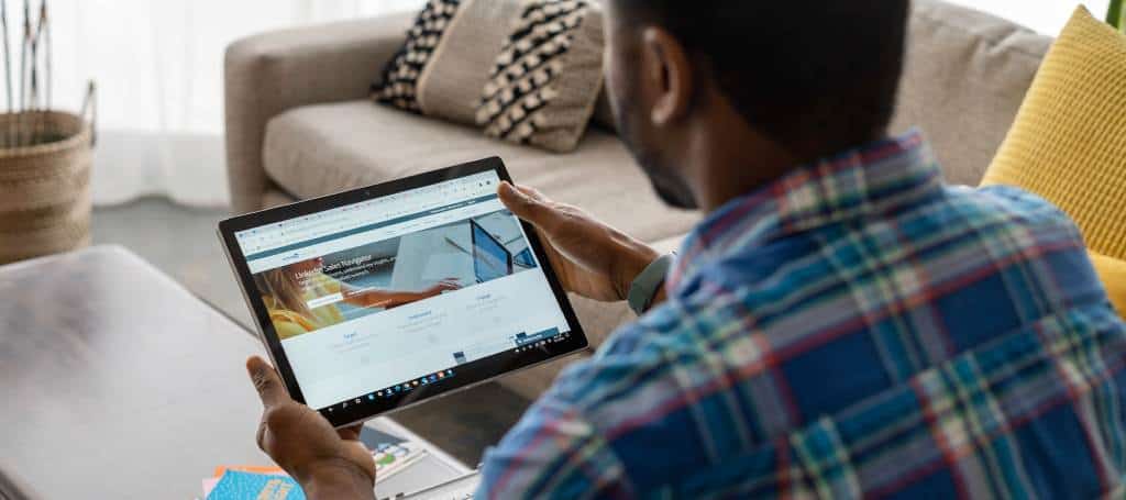 Influencer in living room researching a brand before reaching out