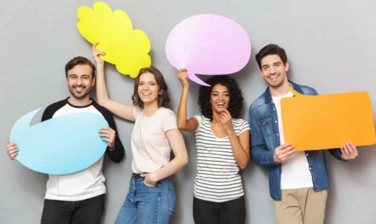 Happy influencers holding up speech bubble boards