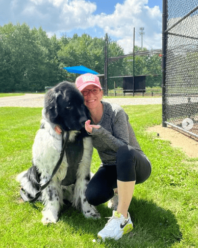 Influencer Jennifer Costello with her pet dog in the park