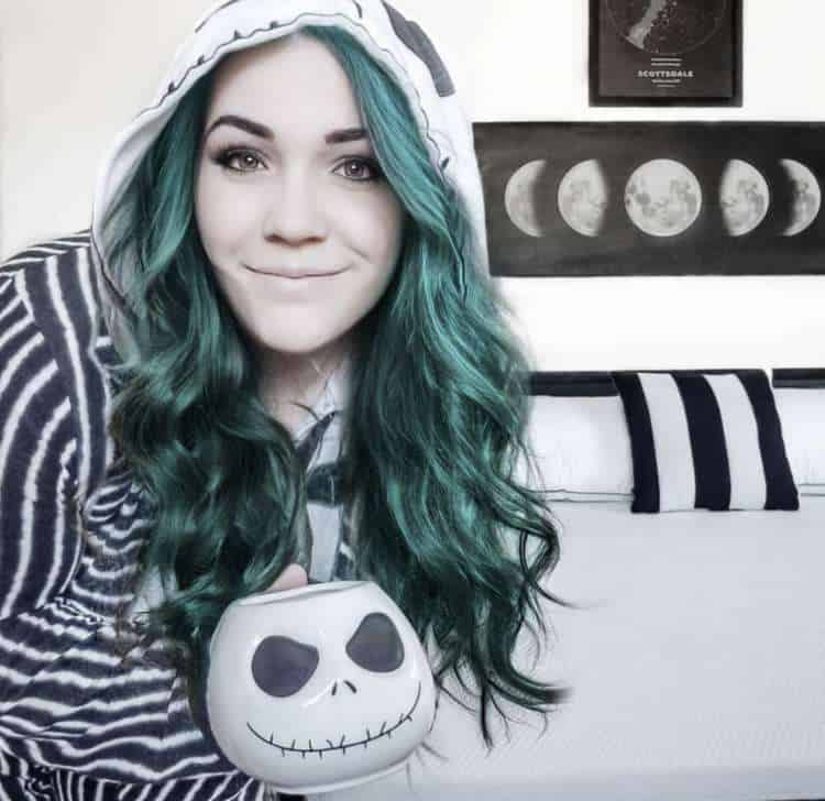 Kelsey Thelen in Nightmare Before Christmas Onesie | Parenting influencer