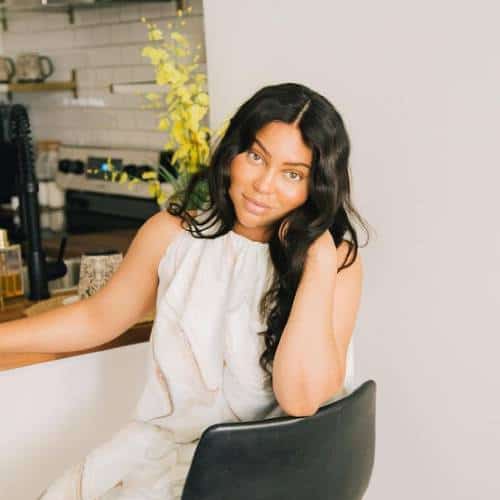 Kiersten H sitting at the kitchen bar | Black Influencers Featured on Afluencer