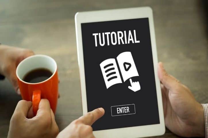 Tutorial screen on ipad with a coffee in hand