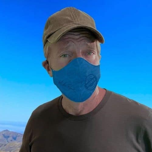Reality TV Star Mike Rowe wearing baseball cap and mask