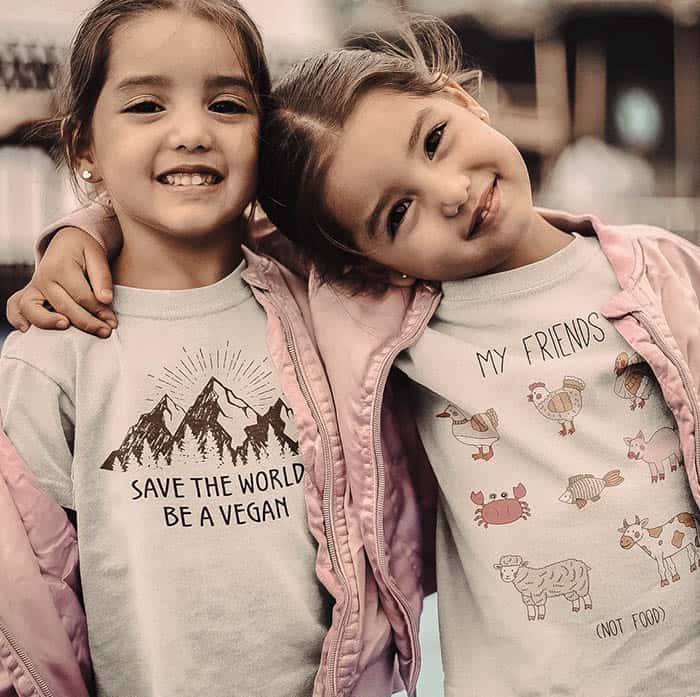 Happy sisters in matching clothes | Children's Clothing Brands