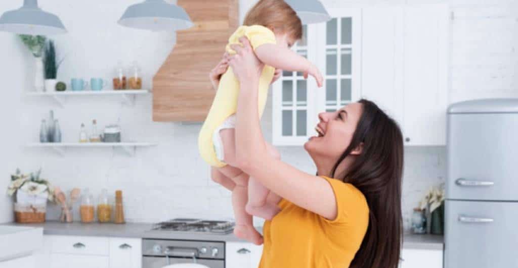 Mother Lifting Child into the Air