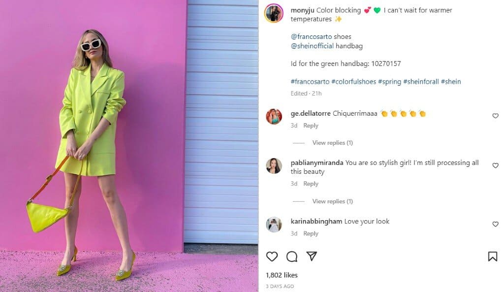 Moniqueleite in yellow blazer modeling in front of pink garage | Fashion bloggers in Utah