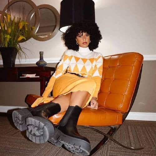 Naazneen Lalji | Sitting legs up on retro chair | Top Social Media Influencers on Afluencer
