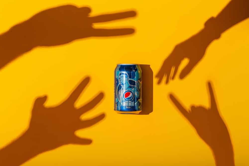 Pepsi can with shadow hands reaching for it | Building a Brand Narrative with Influencers