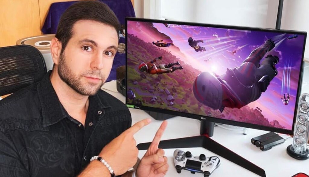 Vagetta777 pointing at his gaming monitor