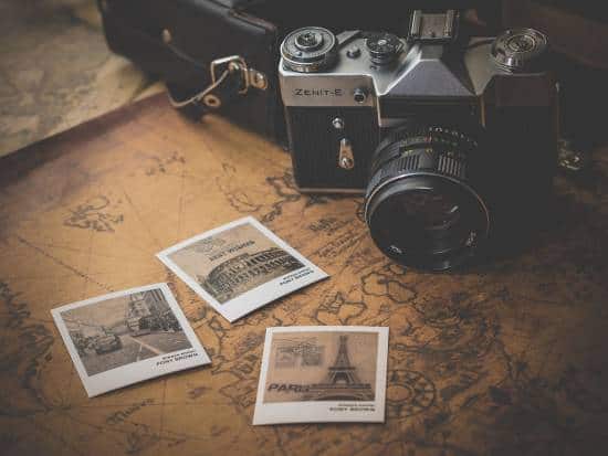 Camera, Printed Photos and Traveling Map